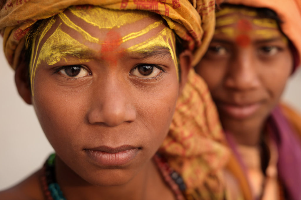 boys from india with painted faces and turbans